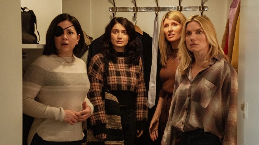 Main cast of Bad Sisters, four women standing in front of coat hooks and a shelf
