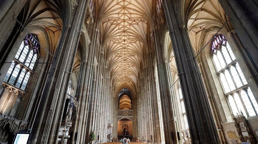 Photo taken from the floor looking up at the towering interior and roof of Canterbury Cathedral