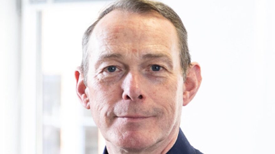 Close up of Pact CEO John McVay in dark shirt against white background