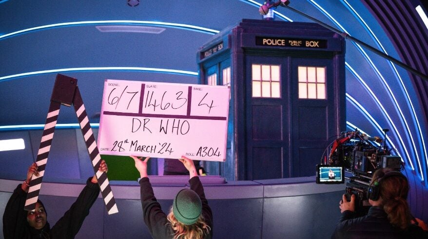 On set of Doctor Who with a woman holding a clapperboard
